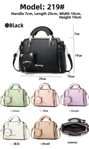 Detailed view of women's handbag set with cat coin purse and metallic zipper hardware