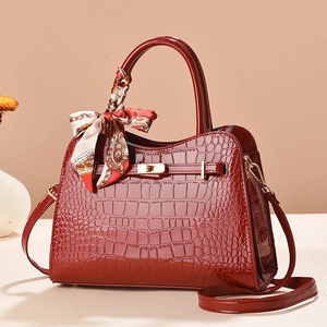Elegant dark red crocodile embossed leather handbag with metal lock and silk scarf