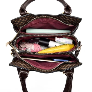 Top view of retro printed handbag showing multi-compartment interior and spacious storage