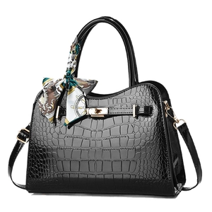 Elegant black crocodile-pattern patent leather handbag with metal lock and silk scarf