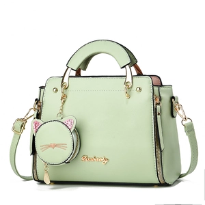 Mint green cat purse with lychee texture, top handle, cross-body strap and coin pouch