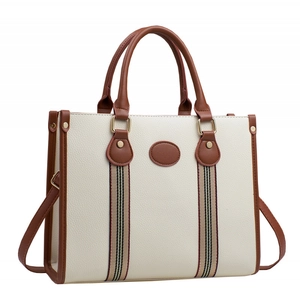 Large white tote bag with brown leather handles and striped webbed ribbon detail