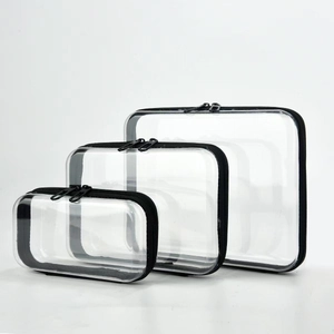 Driedelige set transparante PVC-make-uptassen in verschillende maten met zwarte bies