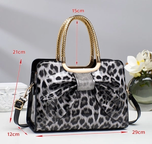 Detail view of leopard print handbag with rhinestones and dimensions 29x21x12cm