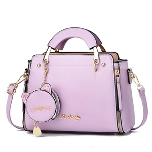 Lavender purple fashion handbag with cute cat charm and adjustable shoulder strap