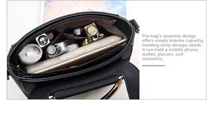 Top view of spacious interior with magnetic snap, leather texture, and daily essentials