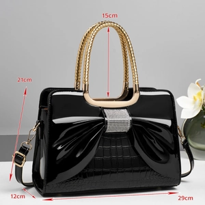 Detailed dimensions of bow knot handbag with 29x21x12cm markers and top handle height