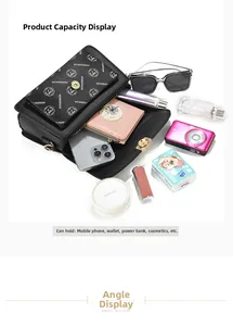Top view showing the spacious interior of the black printed leather crossbody handbag