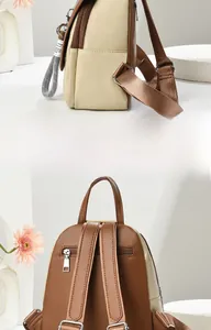 Vue détaillée du sac à dos bicolore montrant le profil latéral et la poche arrière antivol