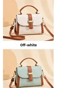 Detail view of stylish leather crossbody bags with metal buckle and top handles