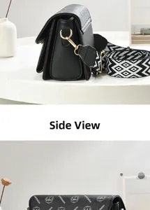 Side view of printed shoulder bag with wide strap and multi-layer interior storage