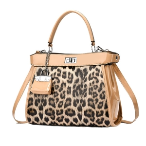 Fashionable leopard print handbag with glossy leather handle and metal twist lock detail