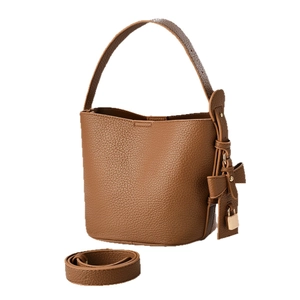 Brown lychee leather bucket bag with bow charm and adjustable strap for women