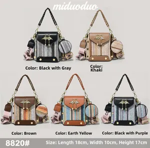 Detail of five woven texture square bags with swan clasps and printed wide straps