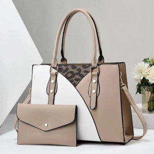 Detail view of the two-piece handbag set featuring beige, white, and leopard patterns
