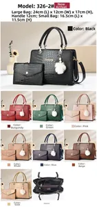 Detail view of two-piece handbag set featuring crocodile pattern and gold-tone logo