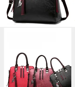 Detail view of textured PU leather bags in black, red, pink and grey with cat pendants