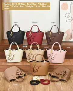 Detailed view of bucket bags in multiple colors with pebbled leather and size measurements