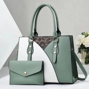 Two-piece handbag set featuring mint green and white patchwork with leopard print detail