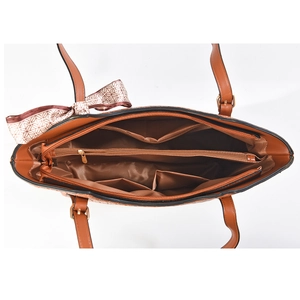 Internal compartments of brown tote bag with zipper pocket and silk bow detail