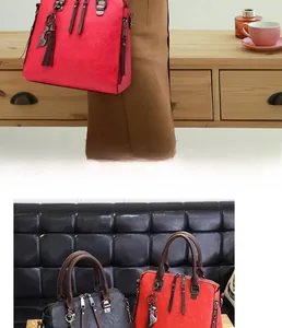 Detailed view of vintage faux leather handbags with cat charm and tassel accents