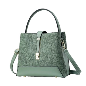 Elegant sage green bucket bag with floral lace overlay and detachable shoulder strap