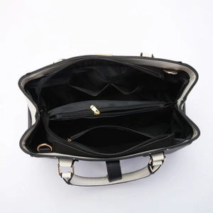 Top view of large capacity handbag showing internal multi-layered compartments and pockets