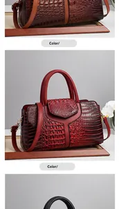 Detailed view of crocodile pattern texture on brown and red faux leather handbags