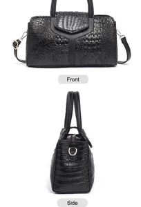 Front and side view of black crocodile pattern handbag with golden metal hardware