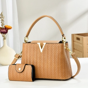Two-piece set of brown herringbone textured tote and crossbody bag with V-shaped buckle