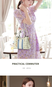 Detail of beige tote bag with blue stripes and golden leaf pendant decoration