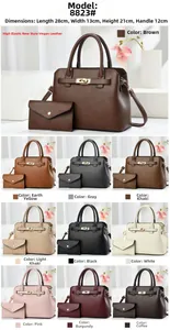 Detailed view of women's two-piece handbag set with turn-lock and leather texture
