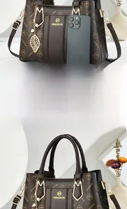 Size comparison of coffee monogram tote bag next to a smartphone for scale