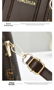 Close-up of golden logo lettering and durable gold-plated metal hardware on leather