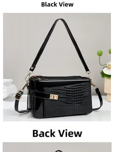Detailed back view of black crocodile pattern handbag with three zipper compartments