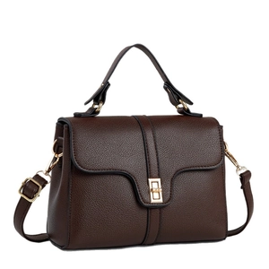 Deep brown pebble grain leather handbag with gold twist lock and adjustable strap
