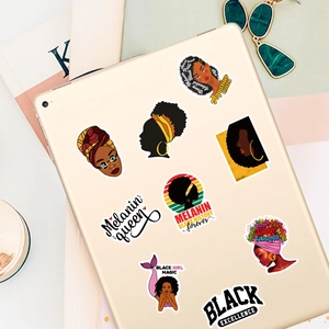 Flat lay of artistic melanin queen stickers on a tablet for fashion lifestyle decor