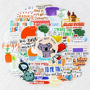 Vue à plat de stickers colorés avec citations inspirantes et motifs de fleurs et koalas