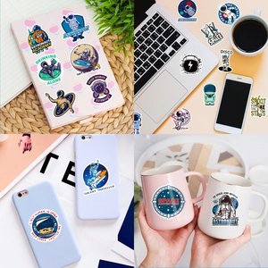 Waterproof astronaut stickers applied on laptop, phone case, and mug in daily life scene