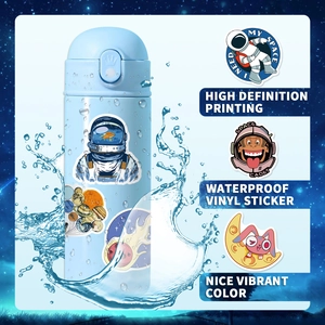 Detail of waterproof vinyl astronaut stickers on a blue water bottle with splashes