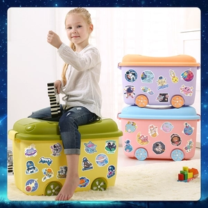 Space stickers for kids showing astronauts and planets on yellow storage boxes