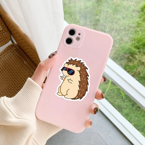 Pink silicone phone case featuring cute hedgehog illustration held by a person's hand