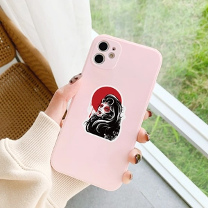 Gothic horror sticker featuring a skeleton girl on a pink phone case held by hand