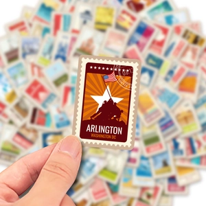 Close-up of a vintage stamp-style sticker featuring the Iwo Jima Memorial in Washington DC