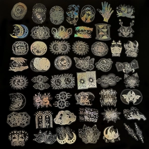 Macro detail of laser holographic magic stickers with sun moon and occult star patterns