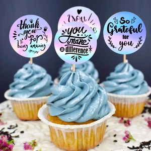 Close-up of holographic laser cupcake toppers with thank you text on blue frosting