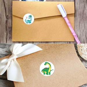 Detail of colorful round dinosaur reward stickers on gift boxes and paper envelopes