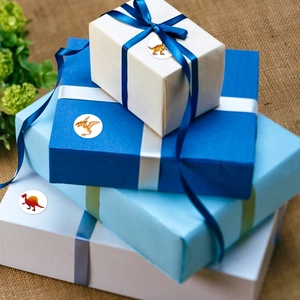 Cartoon dinosaur stickers on a gift box showing application for rewards and decoration
