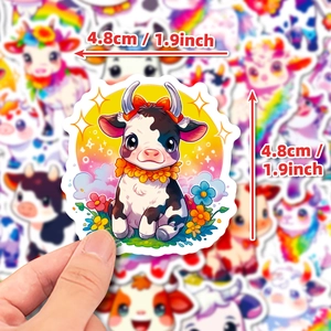 Macro shot of a waterproof cartoon cow sticker with rainbow accents measuring 1.9 inches
