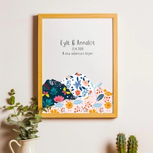 Detailed view of custom wood frame with mountain-shaped floral collage and text
